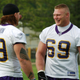 Photo of Lesnar (right) and Chris Hovan by Jim Mone/AP.